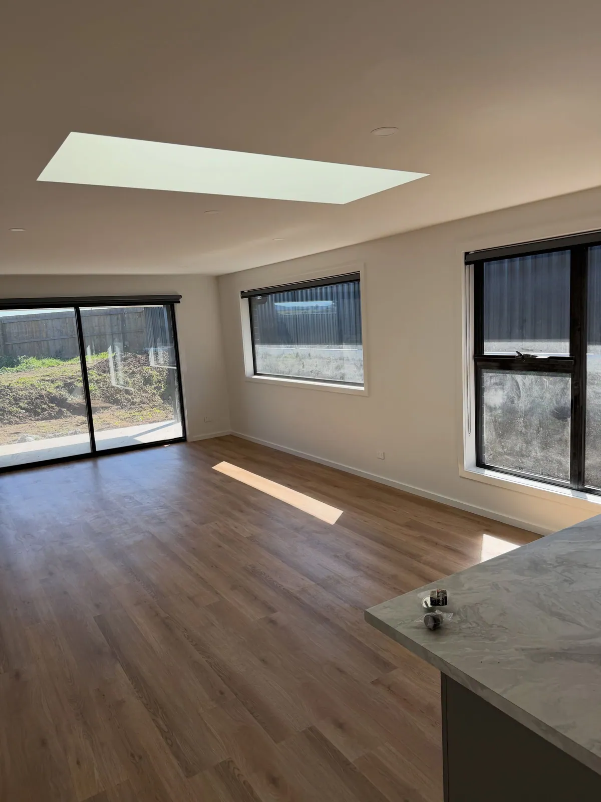 Open-plan living area with a skylight, painted Casper White Quarter